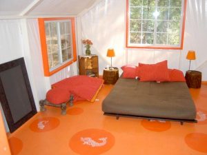 Painted frame and plywood floor in a bungalow used as a cabin